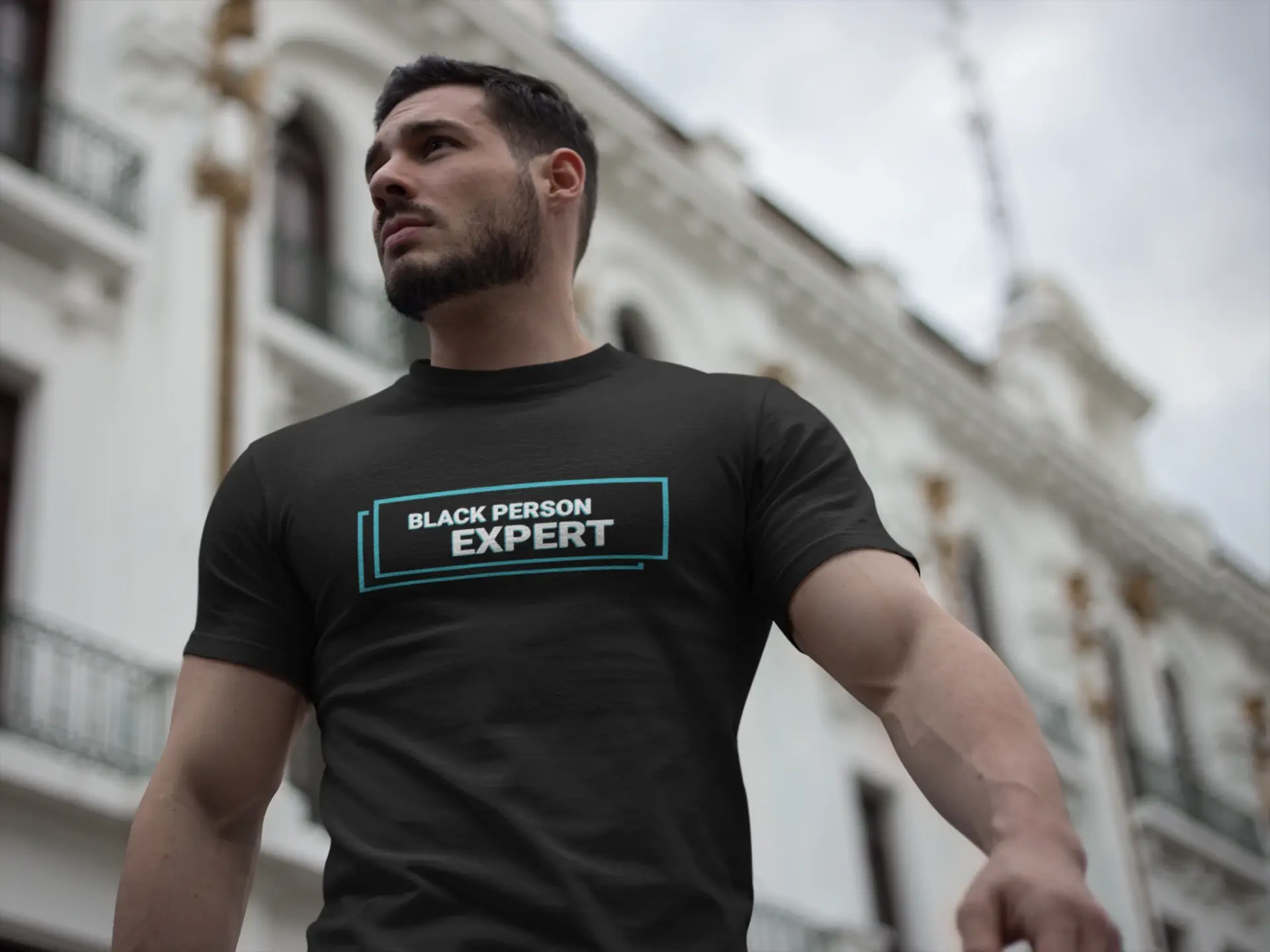 strong handsome man wearing a tshirt mockup while walking in the city a17664